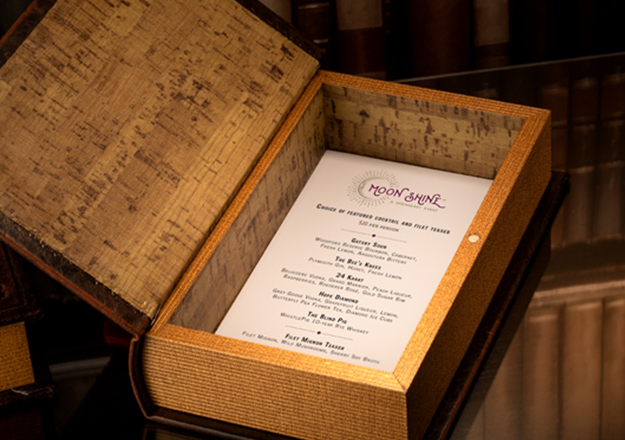 Find the Moon Shine Speakeasy menu hidden in a book